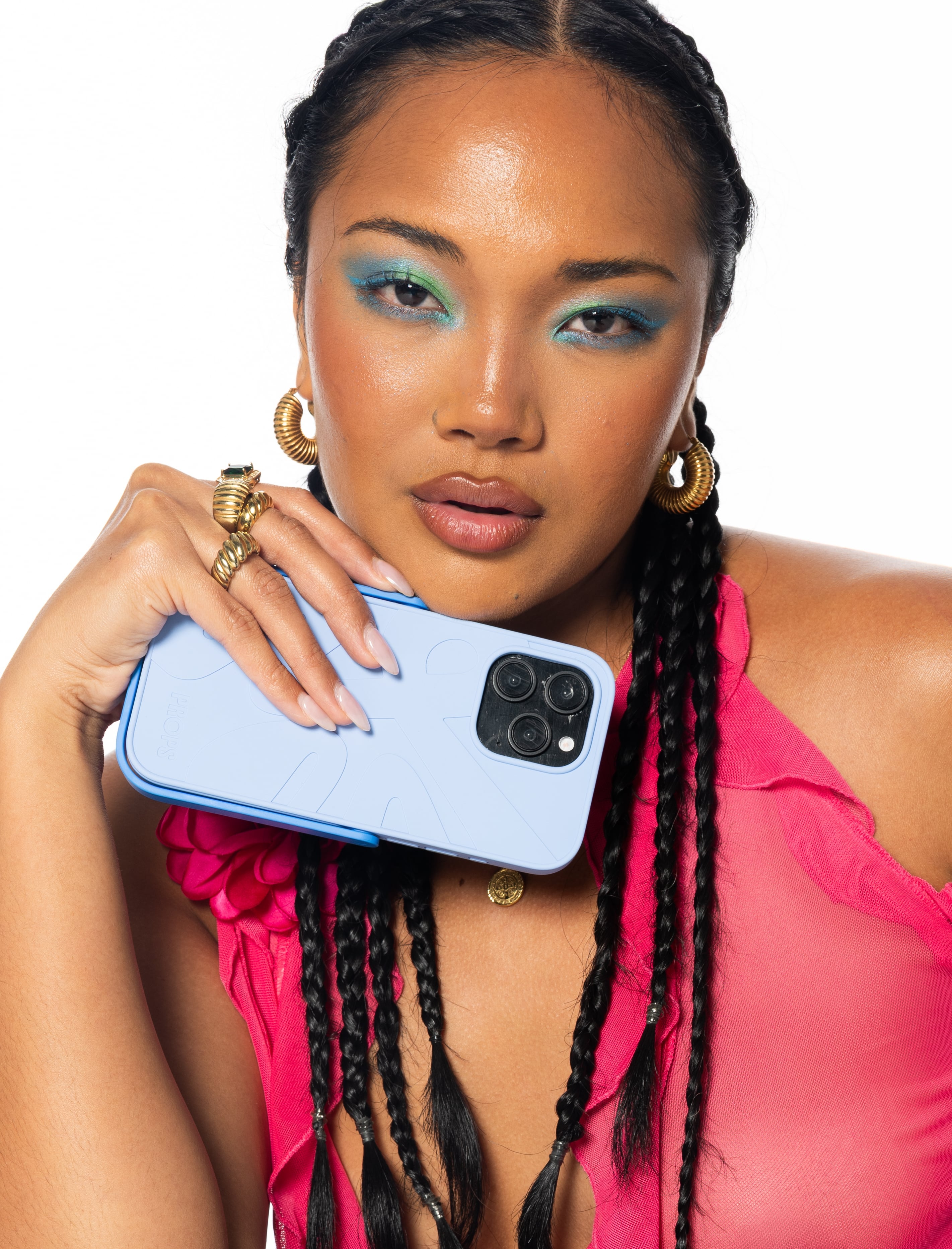 Woman holding an iPhone 16 in a Props case with a white background