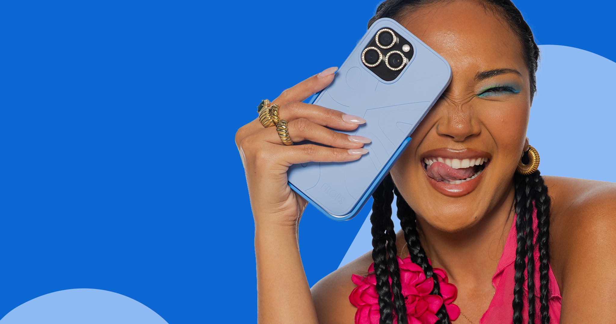 Woman holding a blue iphone 15 pro max case with tripod stand against a blue background