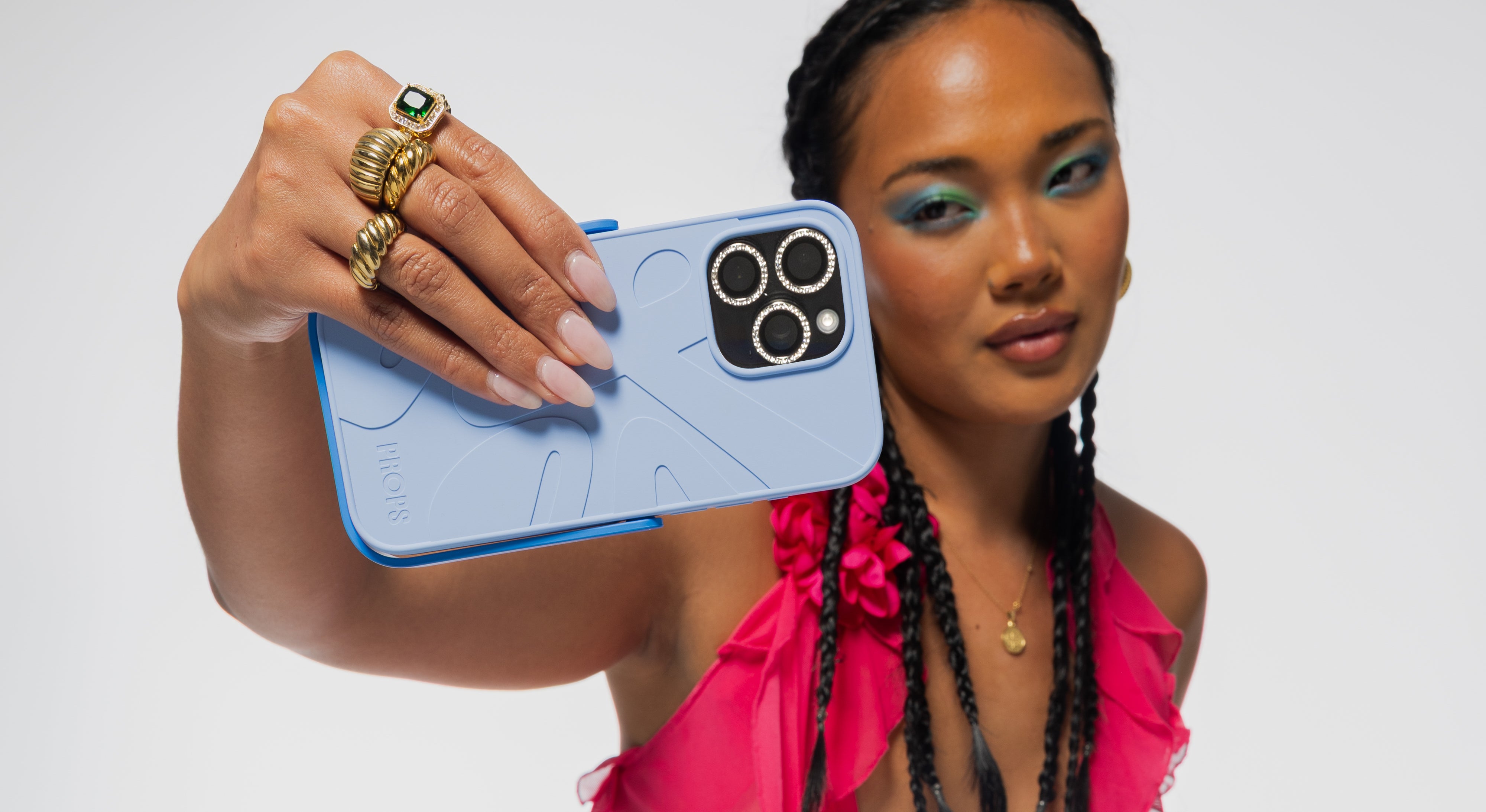 Content creator filming with blue Props iphone case